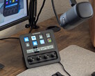 Stream Deck+, connected to a Wave DX, with a PC monitor in the background