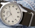 Timex Weekender New England TW2Y86500 with a silver-tone case, cream dial, and dark green leather strap.