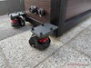 360-degree casters with brakes, power connection in the background
