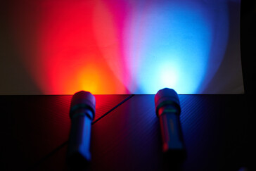 The red light compared with the UV light on a white sheet of paper
