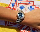 The dial shifts between deep blue, teal, and violet tones depending on the light.