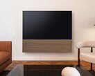 Samsung pairs the S99H OLED Smart TV with a stylish soundbar featuring a wooden front panel.