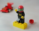 An image showing a LEGO figurine and a race car. (Image source: 2Technology - Pixabay)