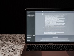 A laptop with an AI chat window open on a dark background; stock image depicting on-premises AI without the cloud.