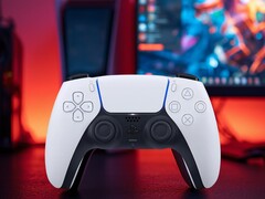 DualSense PS5 controller seen in front of PC monitor